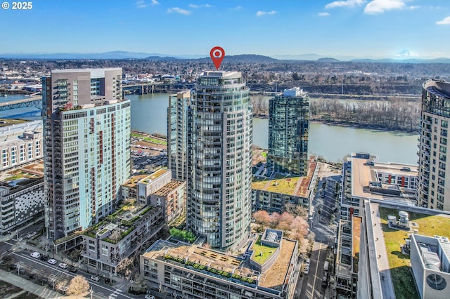 bird's eye view with a water and mountain view and a city view