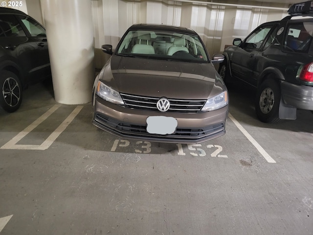 view of vehicle parking featuring a parking deck