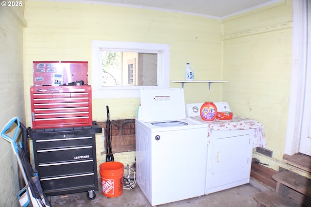 clothes washing area with washing machine and clothes dryer