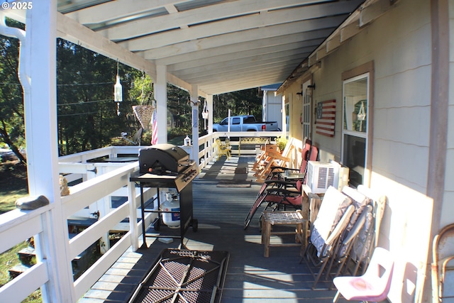 wooden deck with area for grilling