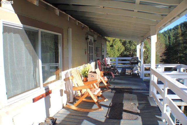 wooden deck featuring grilling area