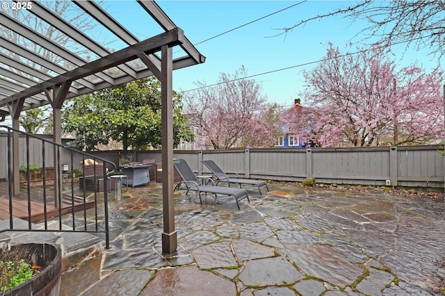 view of patio / terrace featuring a fenced backyard and a pergola