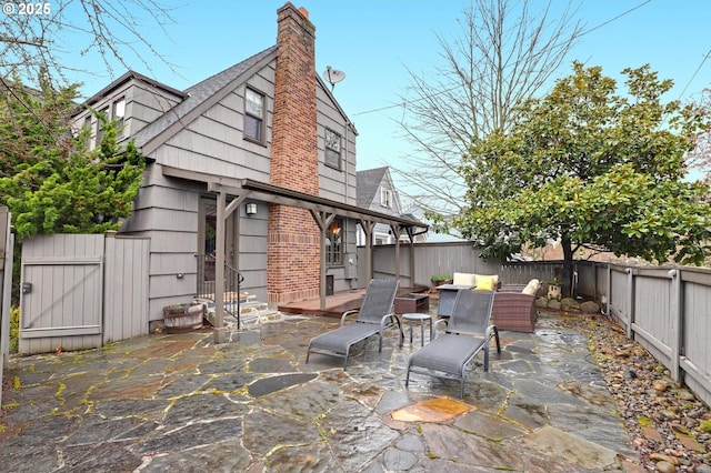 view of patio / terrace featuring a fenced backyard and a gate