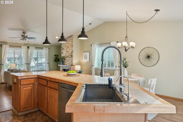 2383 SE 61st Ln, Hillsboro, OR 97123 - kitchen with open floor plan, stainless steel dishwasher, a sink, vaulted ceiling, and a chandelier