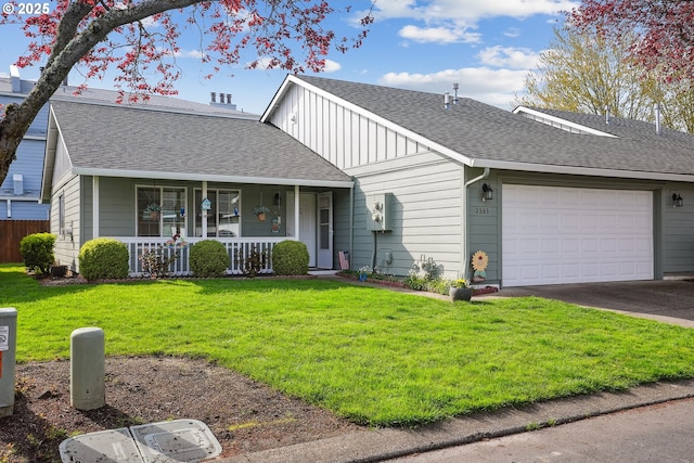 2383 SE 61st Ln, Hillsboro, OR 97123 - view of front of home with a porch, an attached garage, a front yard, asphalt driveway, and roof with shingles