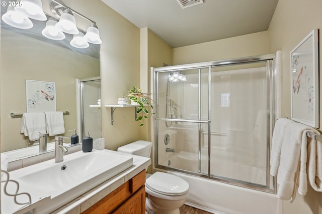 2383 SE 61st Ln, Hillsboro, OR 97123 - bathroom with toilet, vanity, and enclosed tub / shower combo