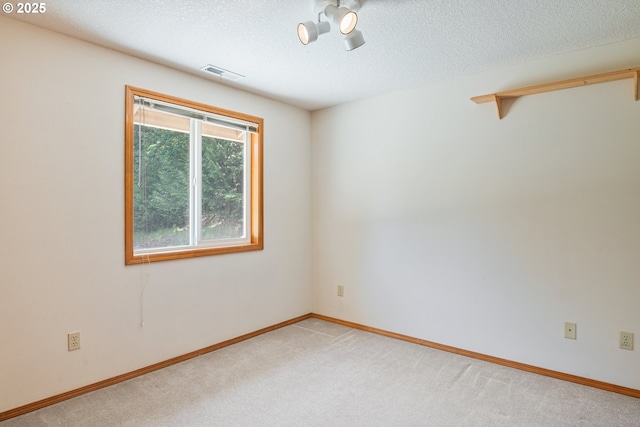 230 S Maple Hill Rd, Kelso, WA 98626 - spare room featuring light carpet, a textured ceiling, and baseboards