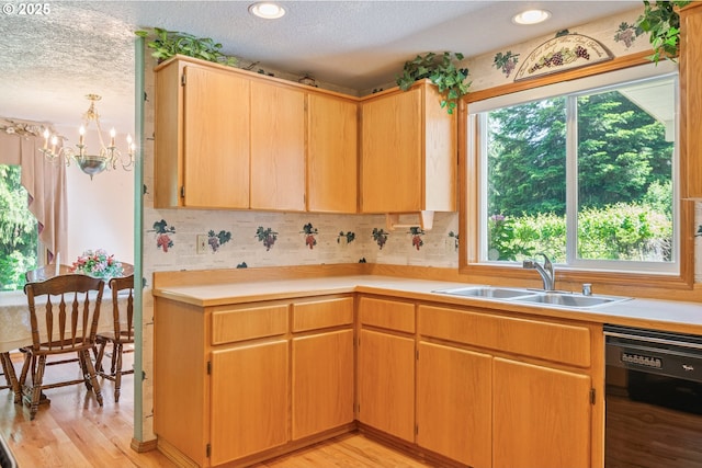 230 S Maple Hill Rd, Kelso, WA 98626 - kitchen featuring a sink, dishwasher, a textured ceiling, light wood-type flooring, and a chandelier