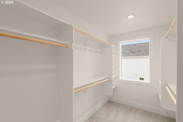 bathroom featuring toilet, hardwood / wood-style flooring, and walk in shower