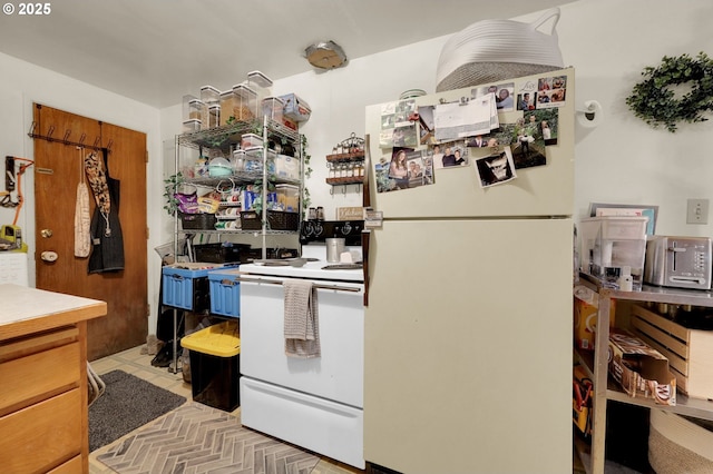 kitchen featuring white appliances and light countertops