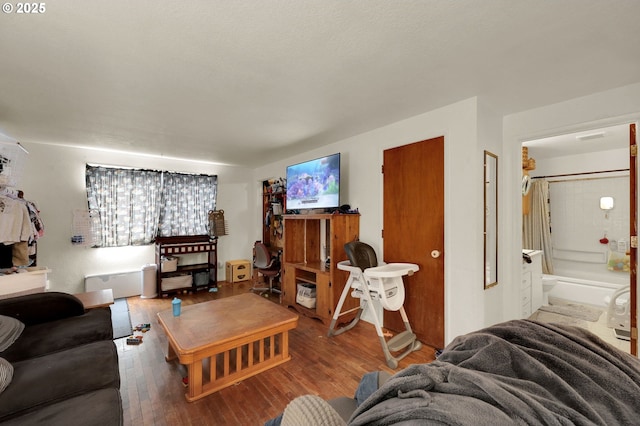 living room with stairway and wood finished floors