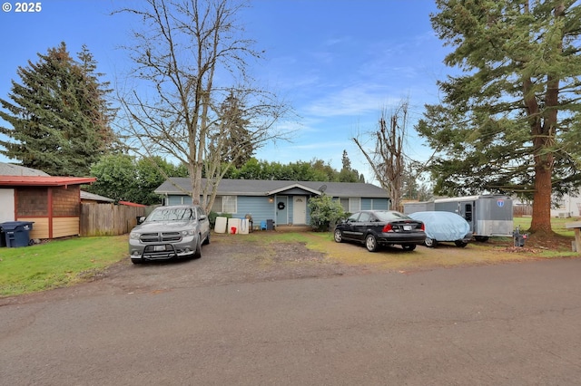 view of front of house featuring fence