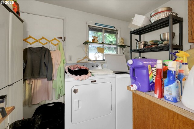 clothes washing area with laundry area and washing machine and clothes dryer