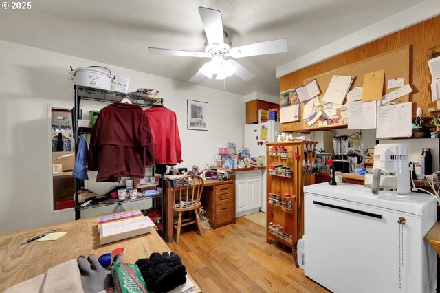 kitchen featuring ceiling fan, light countertops, and light wood-style floors