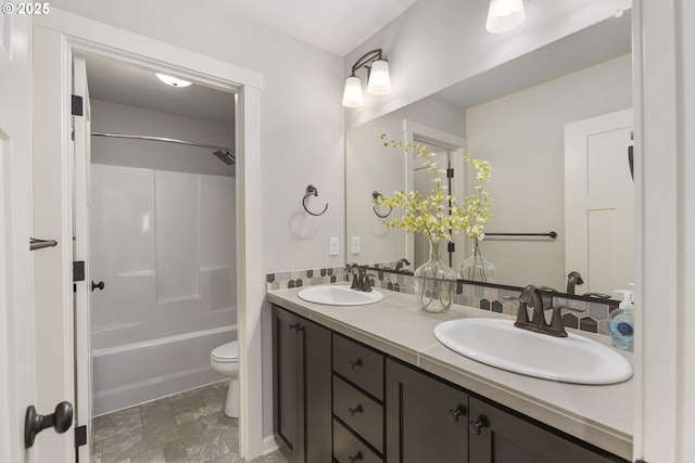 full bathroom with vanity, shower / bathtub combination, and toilet