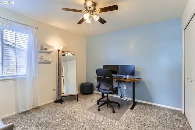 carpeted home office with ceiling fan