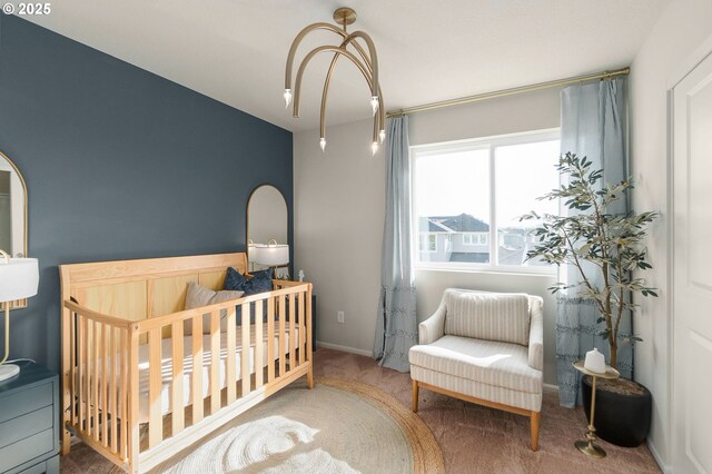 11331 NW Main St, North Plains, OR 97133 - bedroom featuring carpet flooring, a crib, and baseboards