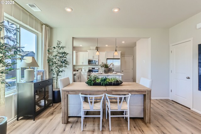 11331 NW Main St, North Plains, OR 97133 - dining room featuring light wood finished floors, recessed lighting, and baseboards
