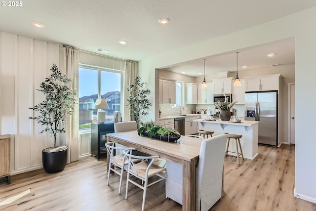 11331 NW Main St, North Plains, OR 97133 - dining room featuring light wood-type flooring and recessed lighting