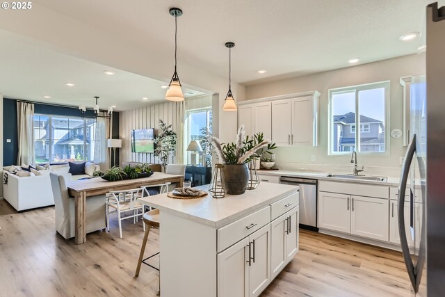 11331 NW Main St, North Plains, OR 97133 - kitchen featuring a sink, appliances with stainless steel finishes, healthy amount of natural light, white cabinetry, and recessed lighting