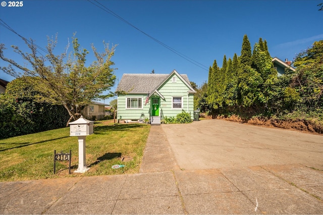 2318 Liberty St, North Bend, OR 97459 - bungalow-style home with a shingled roof and a front lawn