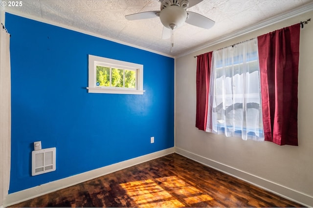 2318 Liberty St, North Bend, OR 97459 - unfurnished room featuring baseboards, crown molding, dark wood-style floors, and ceiling fan