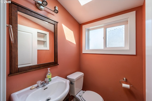 2318 Liberty St, North Bend, OR 97459 - bathroom with a sink, toilet, and vaulted ceiling