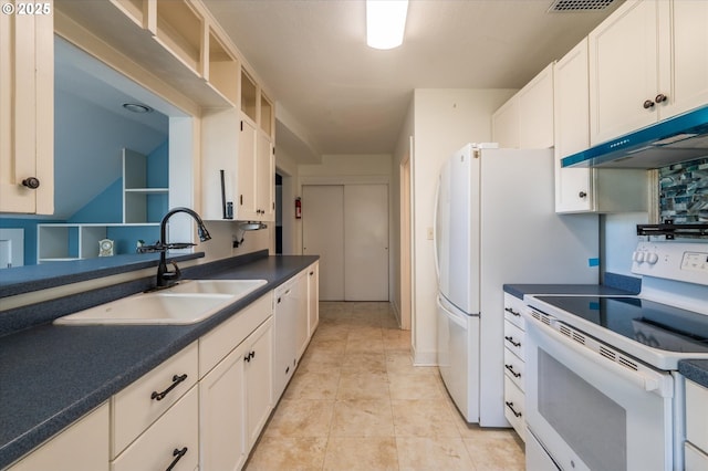 2318 Liberty St, North Bend, OR 97459 - kitchen with white appliances, a sink, under cabinet range hood, white cabinetry, and dark countertops