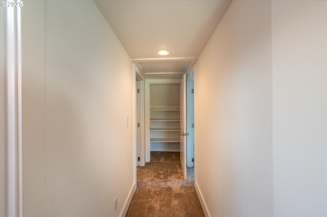 2318 Liberty St, North Bend, OR 97459 - hallway with dark colored carpet, baseboards, and recessed lighting