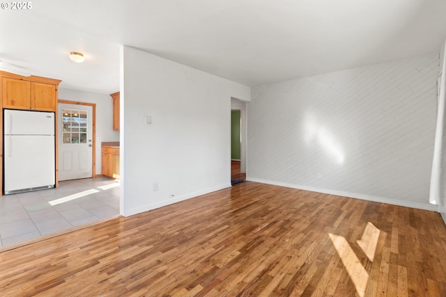 unfurnished living room featuring light hardwood / wood-style floors