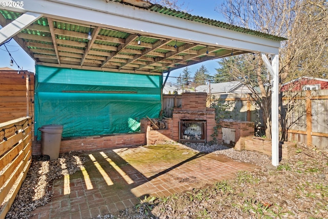 view of patio featuring exterior fireplace