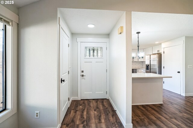 bathroom with a shower with shower door and toilet