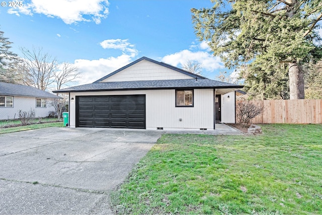 view of front facade with a garage and a front lawn