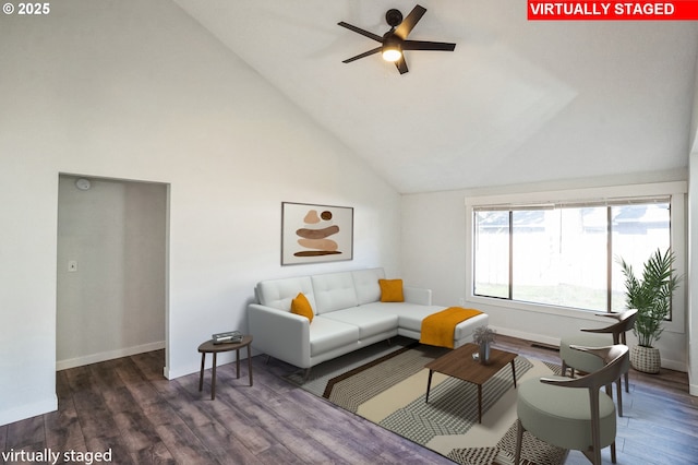 living room featuring high vaulted ceiling, dark wood-type flooring, and ceiling fan