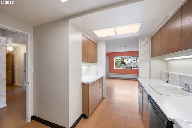 kitchen featuring light floors, light countertops, dishwashing machine, baseboard heating, and a sink