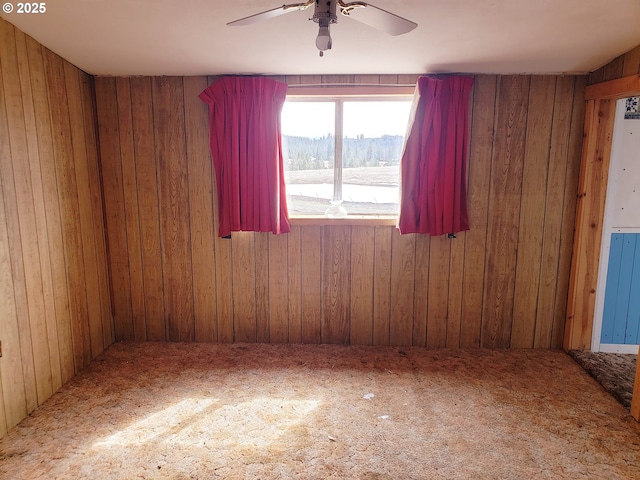 72584 Yarrington Rd, Elgin, OR 97827 - unfurnished room with ceiling fan, wooden walls, and carpet floors