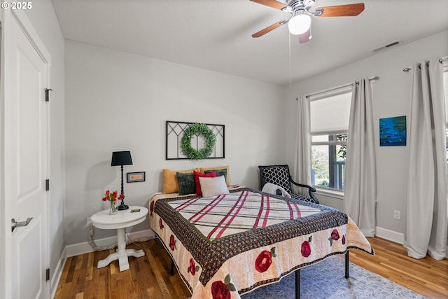 2809 Dead Indian Memorial Rd, Ashland, OR 97520 - bedroom featuring ceiling fan, baseboards, visible vents, and wood finished floors