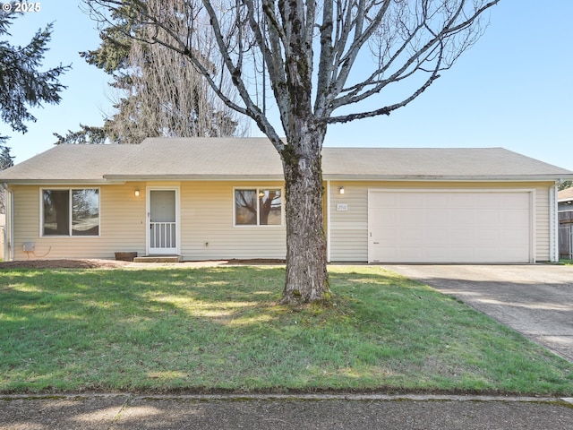 ranch-style house featuring a front yard, a garage, and driveway