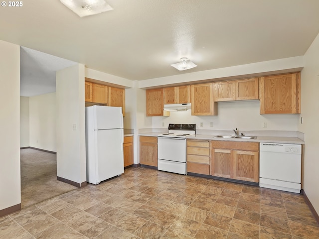 kitchen with white appliances, baseboards, a sink, light countertops, and under cabinet range hood