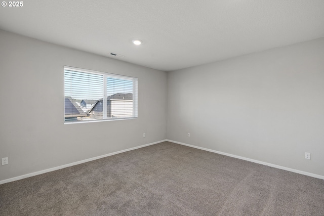 empty room featuring carpet flooring