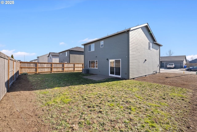 rear view of house with central AC, a yard, and a patio