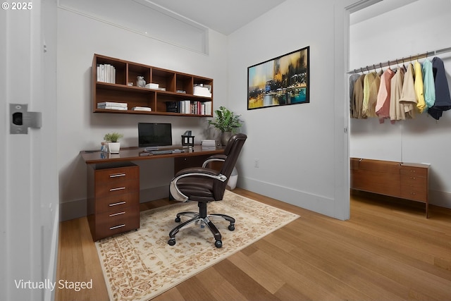 office area with light hardwood / wood-style flooring