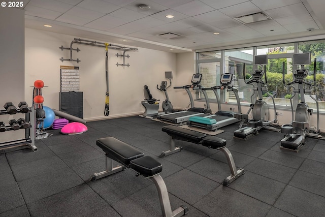 exercise room with a paneled ceiling