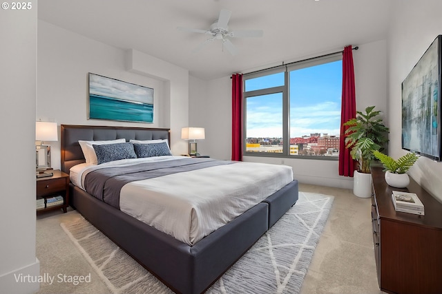 carpeted bedroom with ceiling fan