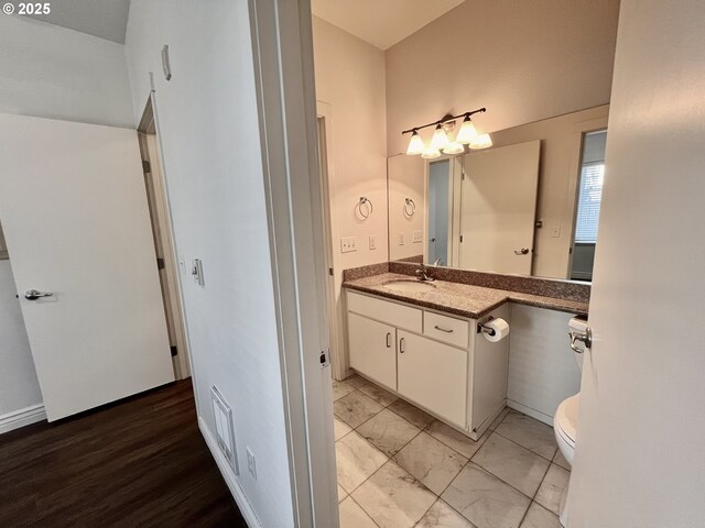 full bathroom featuring toilet, vanity, and bathing tub / shower combination