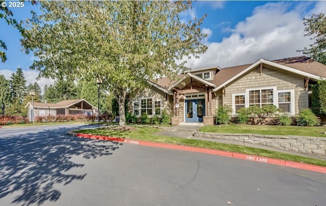 craftsman-style house with french doors