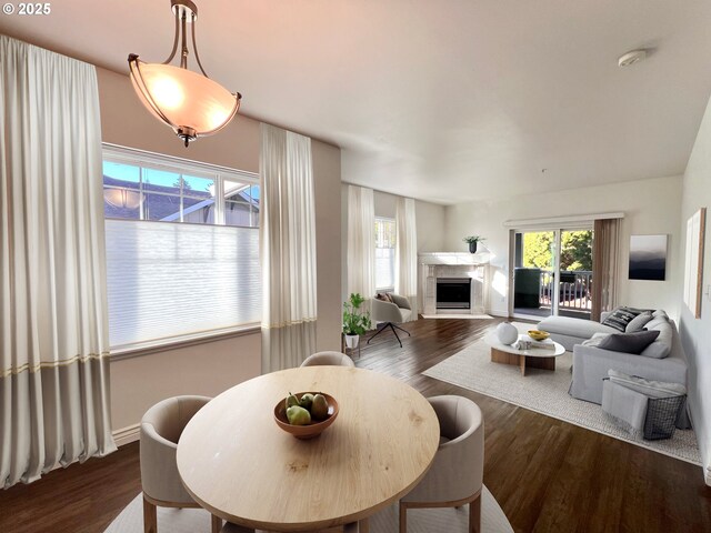 kitchen featuring dark wood-type flooring, stainless steel appliances, light brown cabinets, and sink