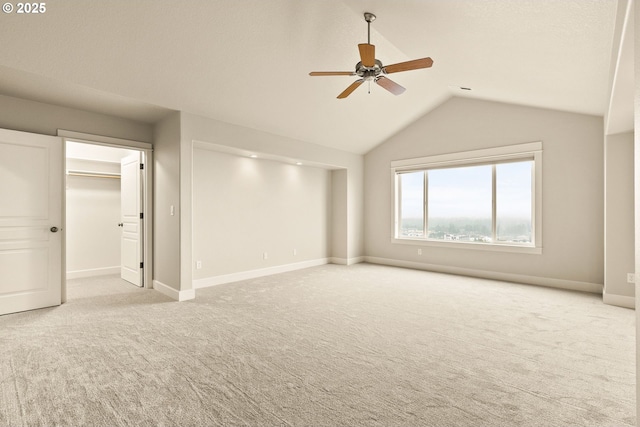 interior space featuring ceiling fan and vaulted ceiling