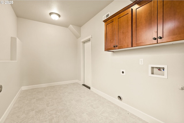 laundry room featuring hookup for a washing machine, electric dryer hookup, and cabinets