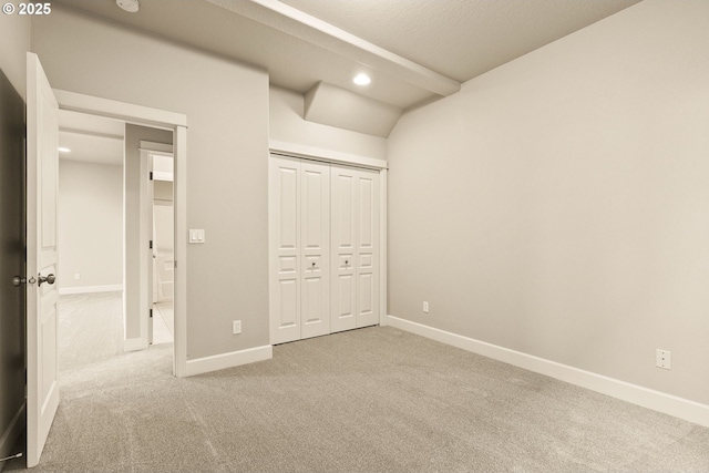 unfurnished bedroom featuring a closet and carpet flooring